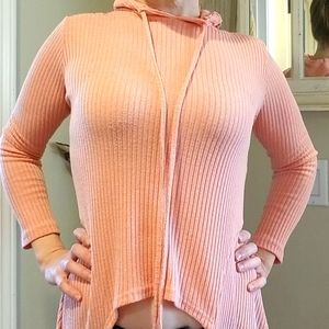 Pink hooded long sleeve shirt with "dress" back